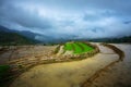 Terraced rice field in water season, the time before starting grow rice, with black clouds coming on background in Y Ty, Lao Cai p Royalty Free Stock Photo