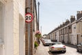 Terraced street showing a 20mph speed limit sign.