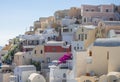 Terraces with Balconies and Chairs on Santorini Caldera on a Sunny Summer Day Royalty Free Stock Photo