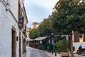 Tossa de Mar, Spain, August 2018. Alley of street cafes under the wall of an old fortress.