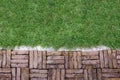 Terracotta brick path pattern with green grass