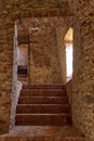 Terracotta brick staircase to the basement, prisons, dungeons Royalty Free Stock Photo