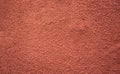 Terracotta colored rough granulated paint texture, gotele, wine color