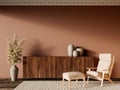 Terracotta interior with dresser, lounge chair and decor. Royalty Free Stock Photo