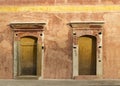 Terracotta Mexican house with two doors in Oaxaca Mexico