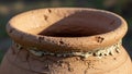 A terracotta pot with a textured rough surface and visible cracks Royalty Free Stock Photo