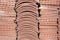 Terracotta roof tiles stacked ready for use with a symmetrical pattern Royalty Free Stock Photo