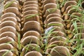 Terracotta roof tiles stacked ready for use with a symmetrical pattern Royalty Free Stock Photo