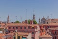 Terracotta rooftops of venetian houses under blue sky in Venice Royalty Free Stock Photo