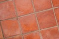 Terracotta tiled floor background - terracotta tiles closeup