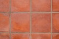 Terracotta tiled floor background - terracotta tiles closeup