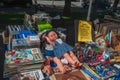 Terragona Catalonia, Spain-August 9, 2013: at a flea market. Sale of various rare antique dolls, magazines and Newspapers, other Royalty Free Stock Photo