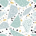 Terrazzo abstract texture or tile. Seamless pattern with blue, yellow and black stone fragments scattered on white