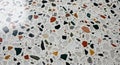 Terrazzo floor composed of a polished surface with an array of irregularly shaped an Royalty Free Stock Photo