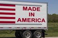 Big rig truck with the motto Made In America painted on the side with red letters and stripes