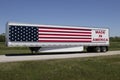 Big rig truck with the motto Made In America painted on the side with stars and stripes of the American flag