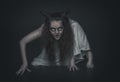 Terrible ghost with horns crawl on dark Royalty Free Stock Photo