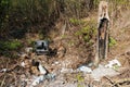 Terrible landfill in the woods. Concept of anthropogenic pollution of forests and nature. There`s a lot of rubbish in the forest Royalty Free Stock Photo