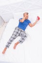 Terrible noise. Insomnia and sleep disorder. Daily routine. What day is today. Stressful man wake up turn off alarm Royalty Free Stock Photo