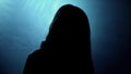 Terrible silhouette of female looking into camera, victim of crazy murderer