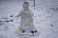 A terrible and ugly snowman made by children in the winter Royalty Free Stock Photo