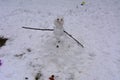 A terrible and ugly snowman made by children in the winter Royalty Free Stock Photo