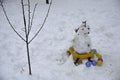 A terrible ugly snowman sculpted from the snow by children Royalty Free Stock Photo