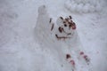 A terrible ugly snowman sculpted from the snow by children Royalty Free Stock Photo