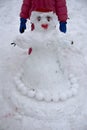 A terrible ugly snowman sculpted from the snow by children Royalty Free Stock Photo