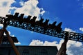 Terrific Silhouette of Sheetah Rollercoaster on sky cloudy background at Bush Gardens Tampa Bay