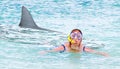 Terrified swimmer fleeing from white shark. Royalty Free Stock Photo