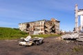 The territory of the abandoned mine. Ruined buildings and a wrecked car. Settlement Khalmer-yu, Russia Royalty Free Stock Photo