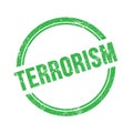 TERRORISM text written on green grungy round stamp