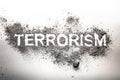Terrorism word written in ash, dust, dirt as awful, dangerous, f Royalty Free Stock Photo