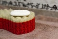 Terry bath towels red sponge and white soap for washing body. Basic bathroom equipment Royalty Free Stock Photo