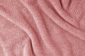 Terry cloth, red towel texture background. Soft fluffy textile bath or beach towel material Royalty Free Stock Photo