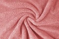 Terry cloth, red towel texture background. Soft fluffy textile bath or beach towel material Royalty Free Stock Photo