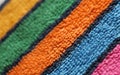 Terry pile structure huckaback towel fabric multicolored striped diagonal close up view