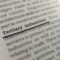 tertiary industries bussiness related terminology displayed on book page Royalty Free Stock Photo