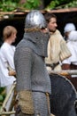 TERVETE, LATVIA - AUGUST 13, 2011: Historical Zemgalu days. Unknown man dressed in ancient armor with weapons and shield