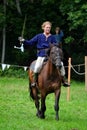 TERVETE, LATVIA - AUGUST 13, 2011: Historical Zemgalu days. Unknown rider on horseback in ancient clothing with ancient weapons