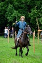 TERVETE, LATVIA - AUGUST 13, 2011: Historical Zemgalu days. Unknown rider on horseback in ancient clothing with ancient weapons