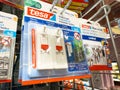 Tesa adhesive hooks display in hardware store aisle Royalty Free Stock Photo