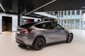 Tesla car model Y grey performance quicksilver in Studio, grey electric vehicle in showroom, alternative energy development