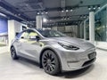 Tesla car model Y in liquid silver dubbed Mercury Silver Metallic color in Studio, electric vehicle in showroomr, alternative