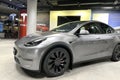 Tesla car model Y in liquid silver dubbed Mercury Silver Metallic color in Studio, electric vehicle in showroomr, alternative