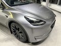 Tesla car model Y in liquid silver dubbed Mercury Silver Metallic color in Studio, electric vehicle in showroomr, alternative