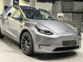 Tesla car model Y in liquid silver dubbed Mercury Silver Metallic color in Studio, electric vehicle in showroomr, alternative