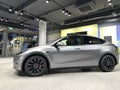 Tesla car model Y in liquid silver dubbed Mercury Silver Metallic color in Studio, electric vehicle in showroomr, alternative