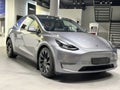 Tesla car model Y in liquid silver dubbed Mercury Silver Metallic color in Studio, electric vehicle in showroomr, alternative